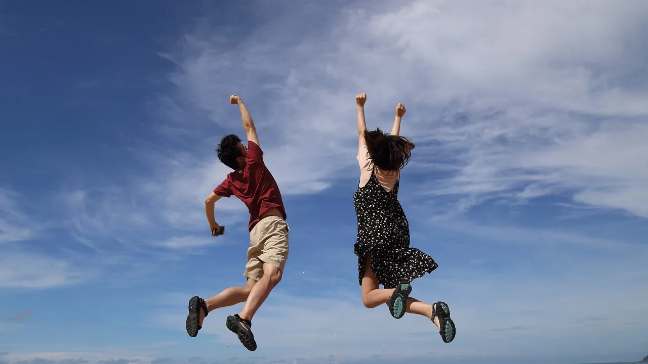 two people jumping. Managing client expectations.